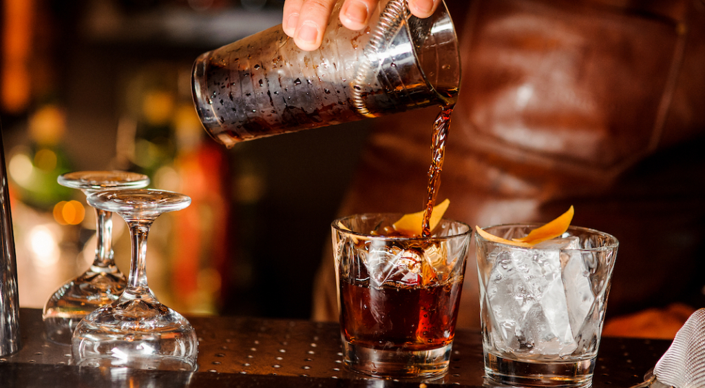shutterstock_785282029-bartender-pouring-cocktails-By-Maksym-Fesenko.jpg